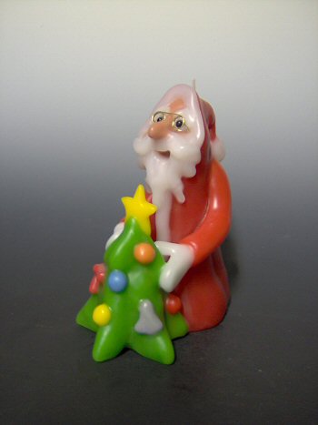 Santa with christmas tree candle